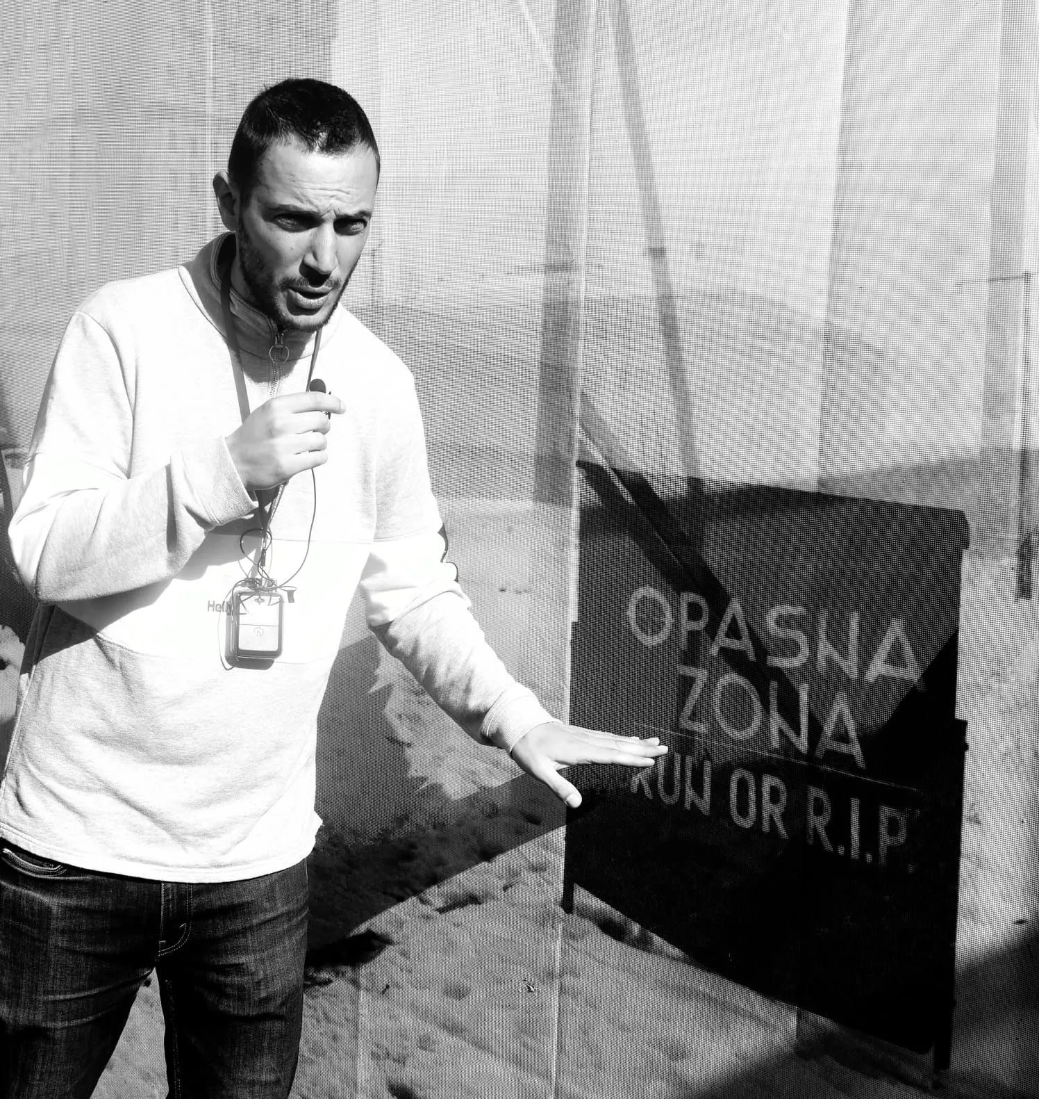 Mak, founder of Roses of Sarajevo, explaining a Sarajevo siege danger zone