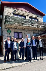A tour group posing outside the Sarajevo Tunnel Museum