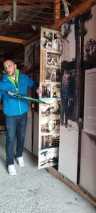 A tour guide explaining the Kolar family exhibition