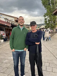 A tour guide posing with Sting in Sarajevo old town