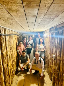 Visitors posing inside the Sarajevo Tunnel of Hope