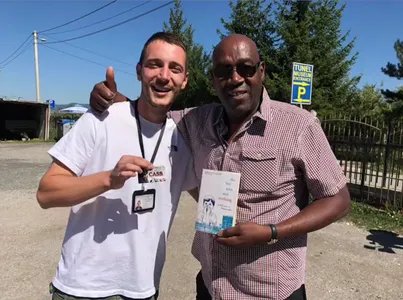 A tour guide posing Cass Pennant outside the Sarajevo Tunnel Museum