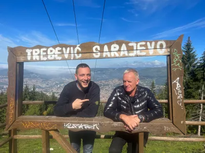 A tour guide pointing to Sting at the Trebevic viewpoint